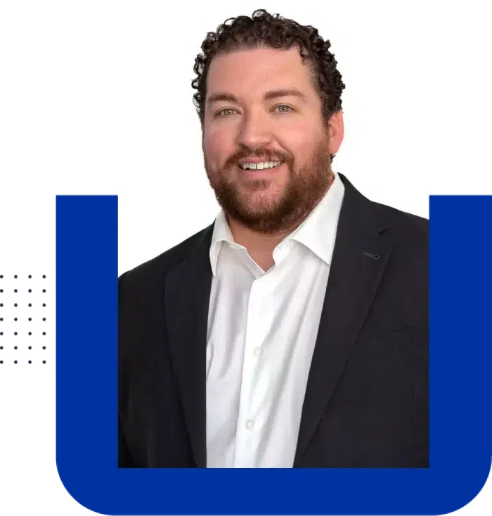 Smiling man in suit jacket portrait.