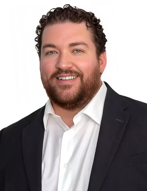 Smiling man in suit jacket portrait.